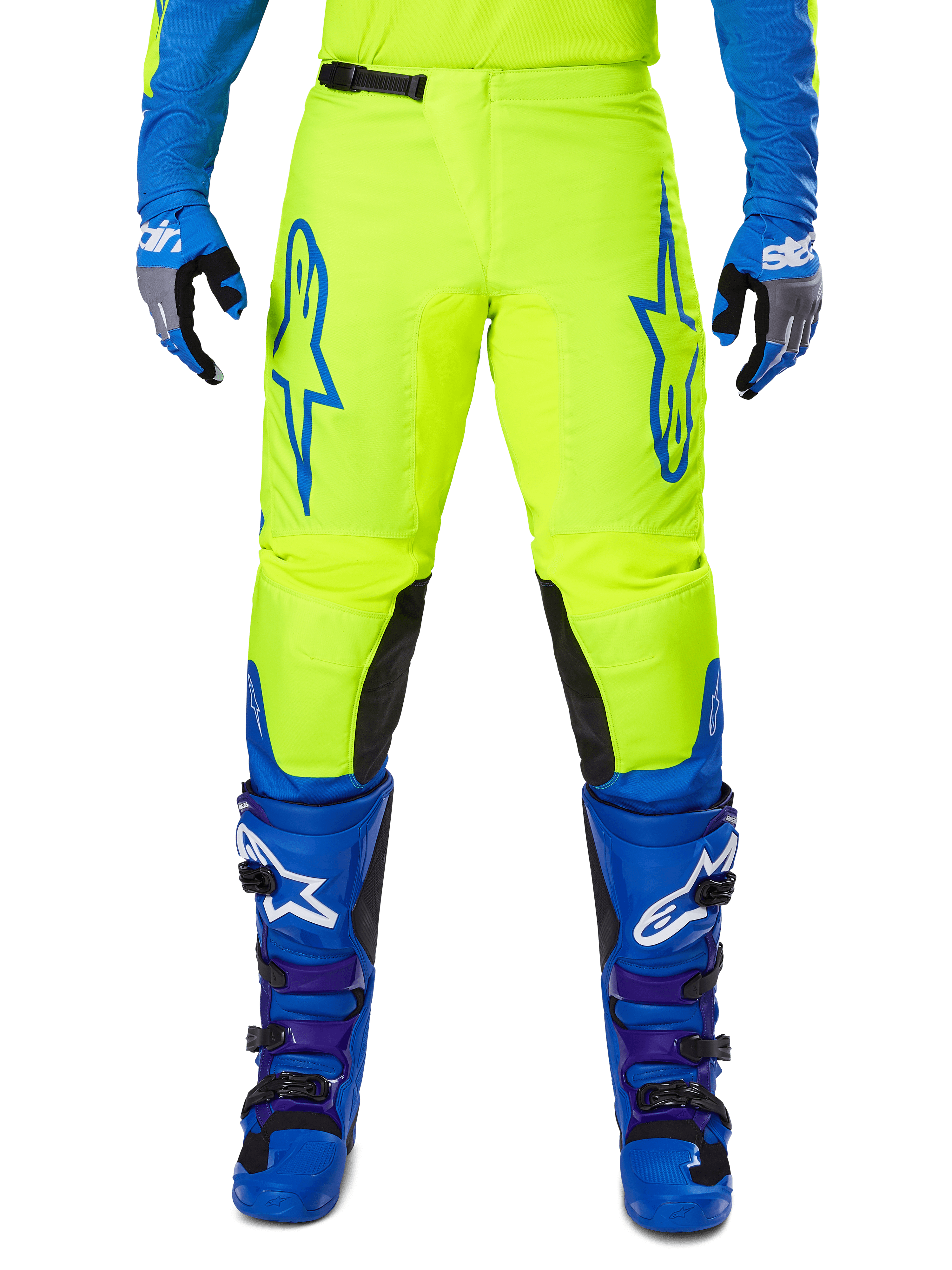 Alpinestars 2025 Fluid Haul Pants, Motocross Pants, Bright Yellow and Blue, worn with matching gloves and boots, featuring black inner knee panels, bold blue branding on the thighs, and a sporty ergonomic design.