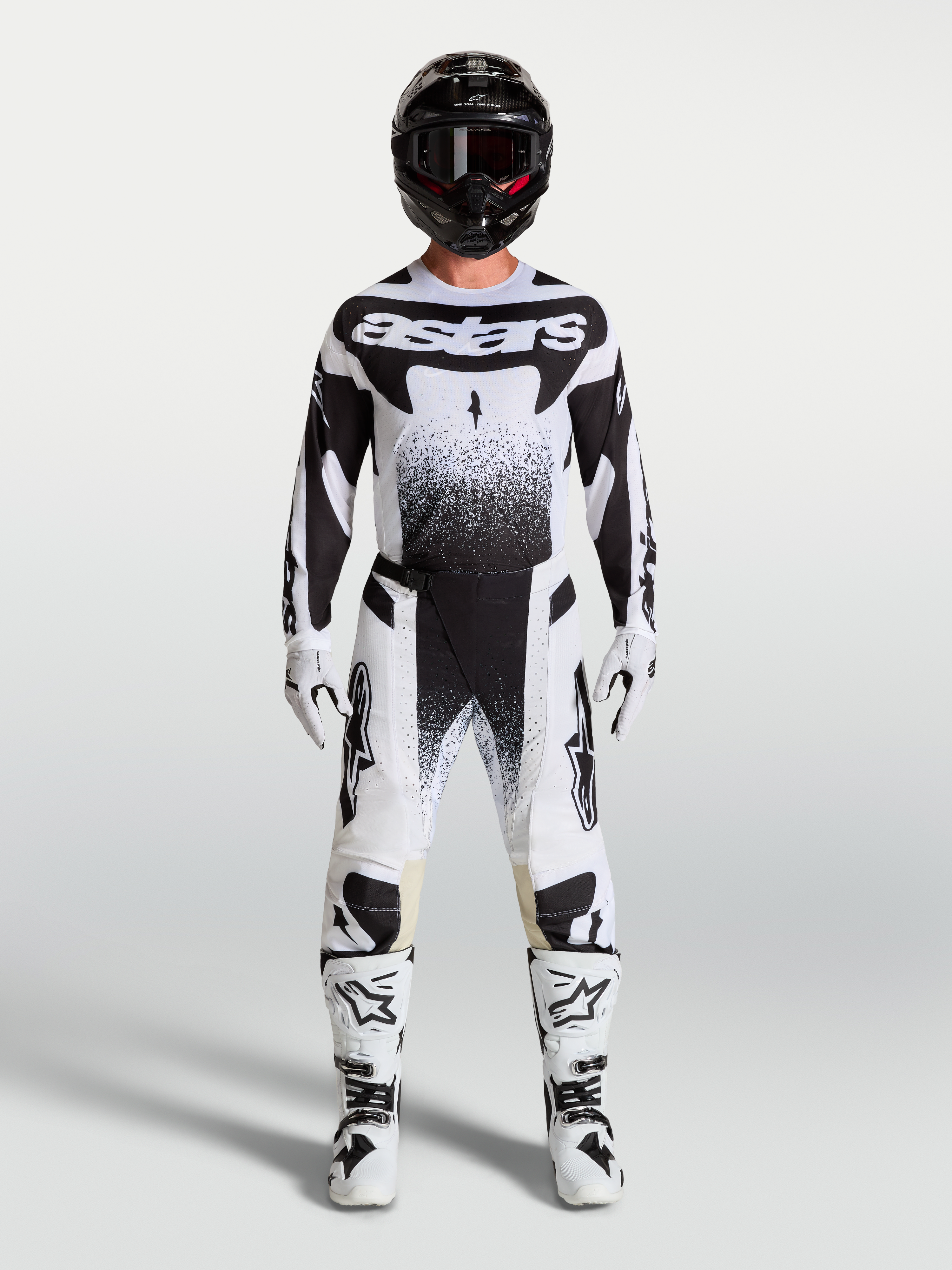 Alpinestars Techstar Swan Pants and jersey, white and black motocross gear set with matching boots on a model.
