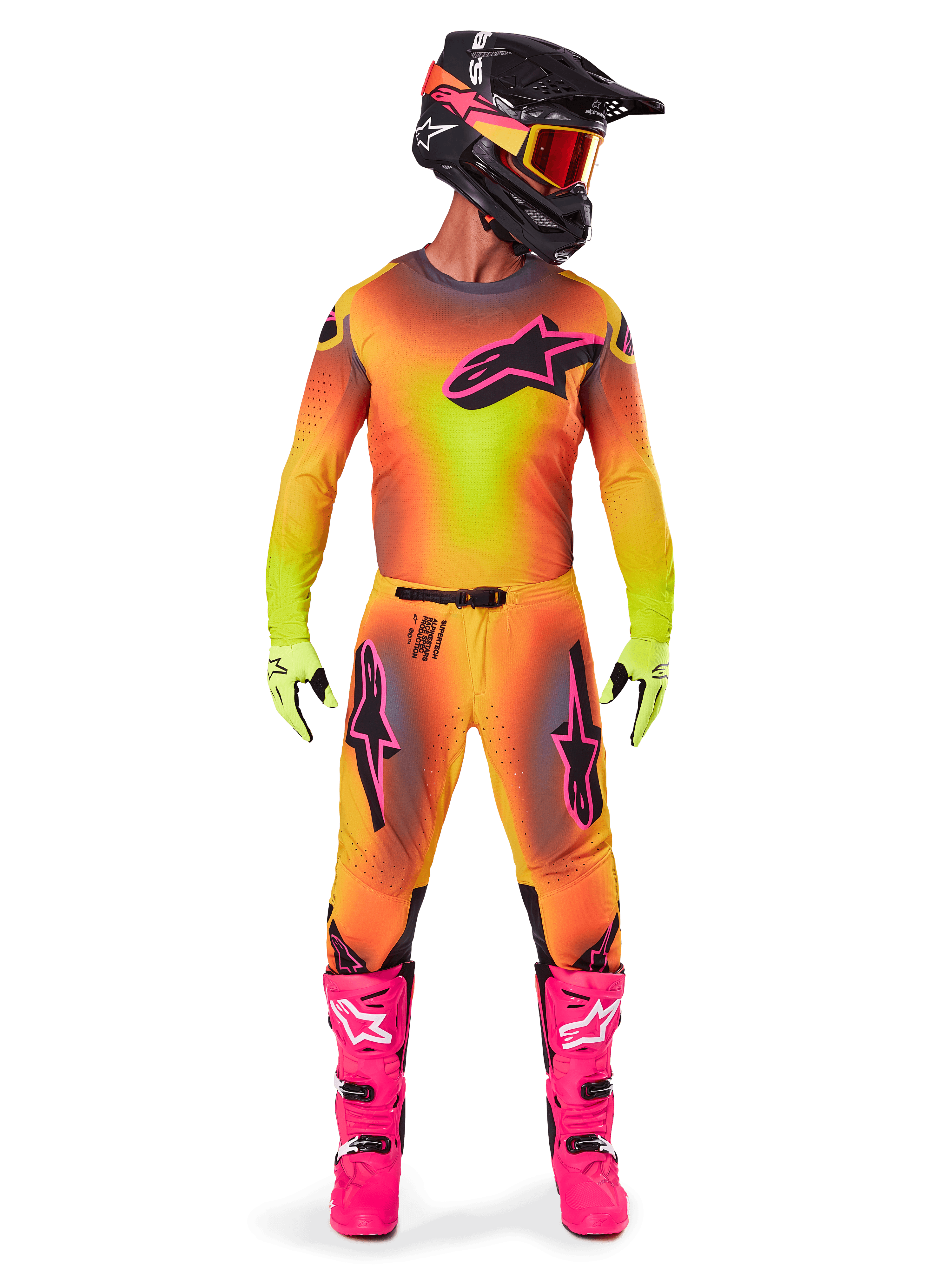 Motocross rider wearing the Alpinestars 2025 Supertech Lipan gear, featuring a vibrant Yellow and Pink gradient design, matching long-sleeved jersey, bright pink boots, lime green gloves, and a black helmet with orange goggles.