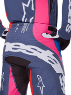 Alpinestars 2025 Techstar Dreem Pants, Motocross Pants, Gray Multicolor with pink and white accents, rear view detail featuring large Alpinestars branding on the seat and tech specification text on the waist, worn as a coordinated racing gear set.