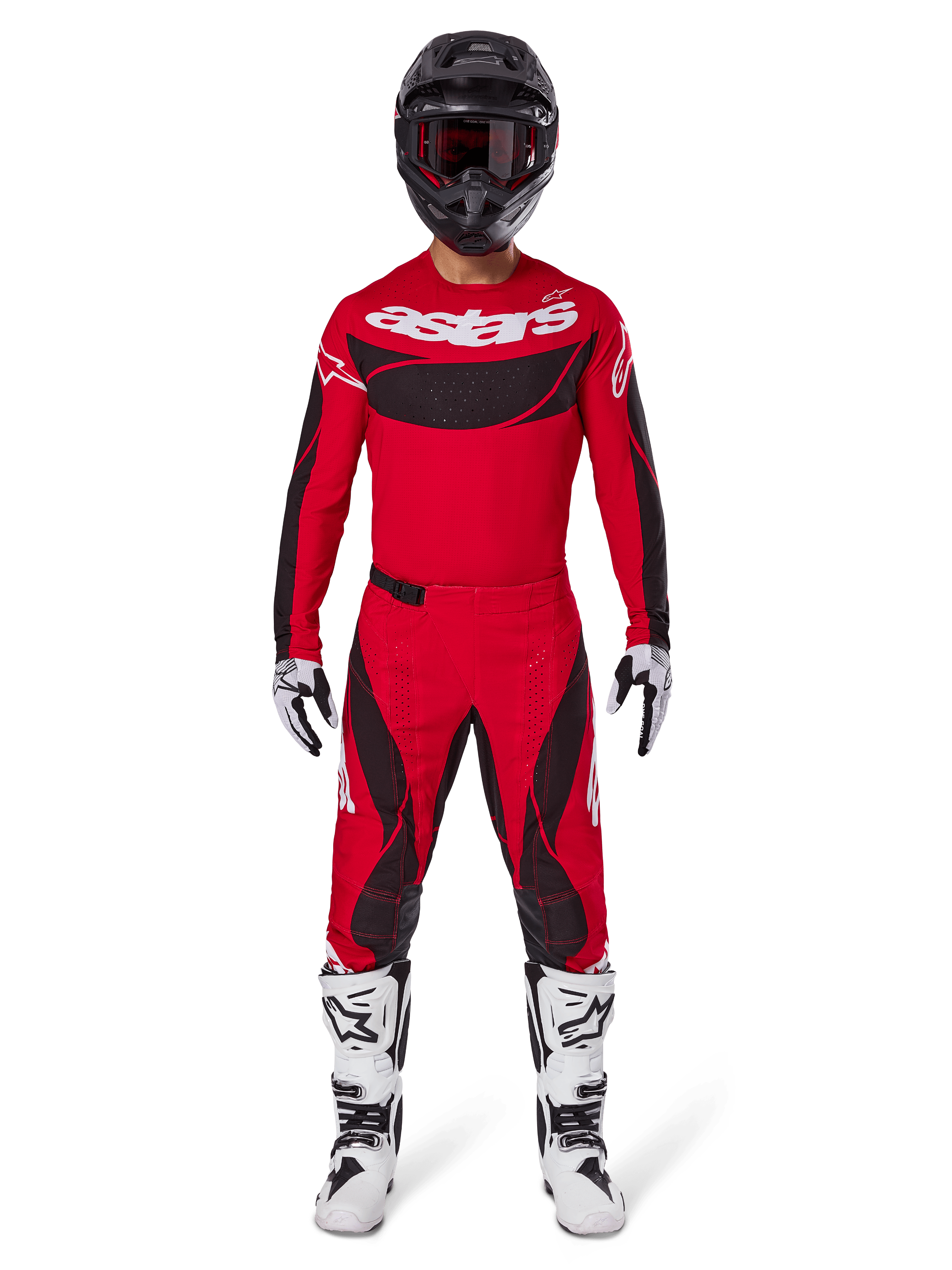 Pantalon Alpinestars Techstar Dreem 2025, pantalon de motocross, rouge vif et noir, porté dans le cadre d'une tenue de course complète avec un maillot rouge assorti, un casque noir et des bottes blanches, design sportif avec un marquage audacieux pour la performance tout-terrain.