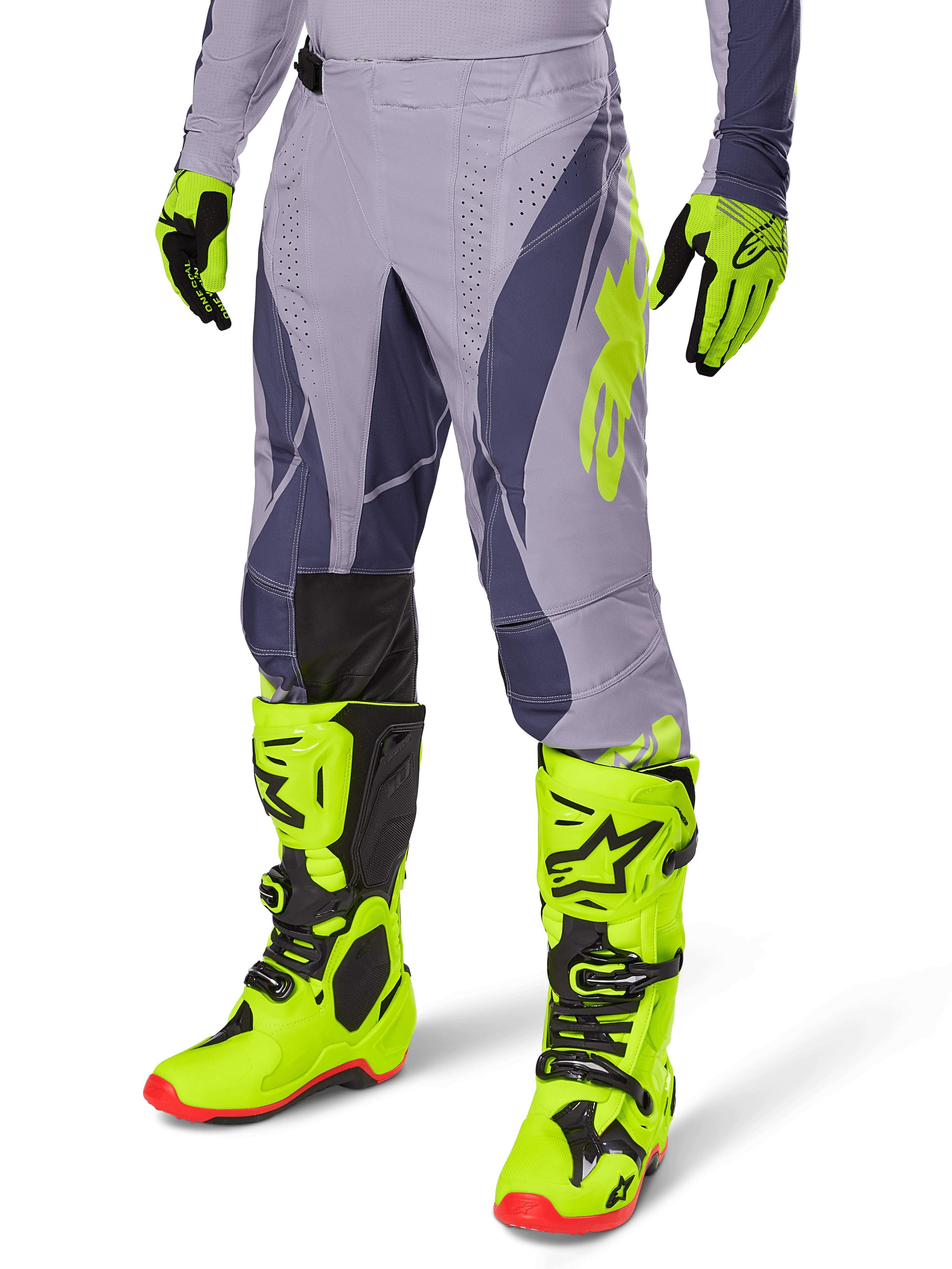 Ensemble d'équipement Alpinestars Techstar Dreem 2025, pantalon et maillot de motocross, gris avec accents violet foncé et jaune fluo, porté avec bottes et gants jaune fluo assortis, coupe de course professionnelle pour motocross tout-terrain