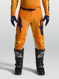 Alpinestars Racer Amber Motocross Pants in orange and deep blue, with durable 600D polyfabric and race fit.