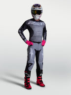 Alpinestars Pantalon Racer Amber et ensemble de motocross pour homme, gris et rose, tenue tout-terrain robuste.