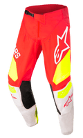 Alpinestars Techstar Factory Pants, pantalon de motocross, rouge avec accents jaune fluo et blanc, panneaux intérieurs noirs aux genoux, grands logos Alpinestars, perforations pour la ventilation et boucle de taille réglable noire