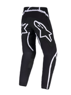 Pantalon Alpinestars Fluid Apex 2026, pantalon de motocross, noir et blanc, vue arrière montrant le grand logo étoilé blanc sur l'assise, design ergonomique avec des accents blancs incurvés, poly-tissu 600D durable pour la performance tout-terrain