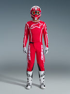 Alpinestars 2026 Fluid Apex Pants, Motocross Pants, Red and White, worn as a full racing gear set with a matching red jersey, white boots, and red and white helmet, featuring bold branding and black panels for off-road performance.