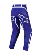 Alpinestars Fluid Apex V2, pantalon de motocross pour homme, bleu foncé et blanc, avec jambes pré-courbées et logo étoile.