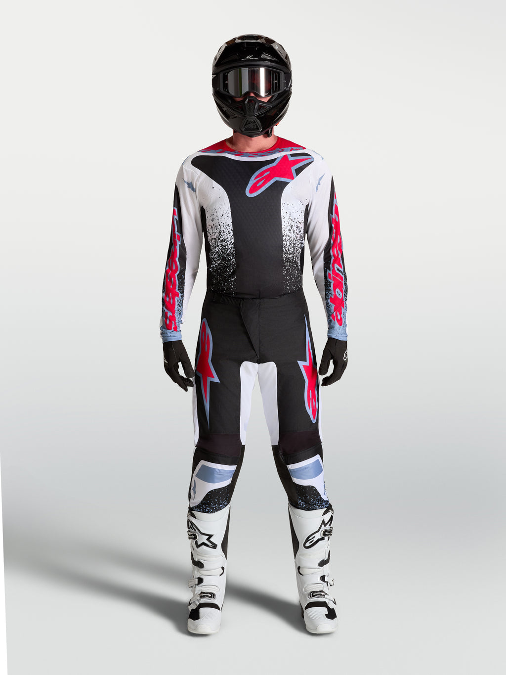 Pantalon Alpinestars Fluid Drag, équipement de motocross pour homme, noir et blanc avec détails rouge fluo, coupe ergonomique et durable pour le pilotage tout-terrain