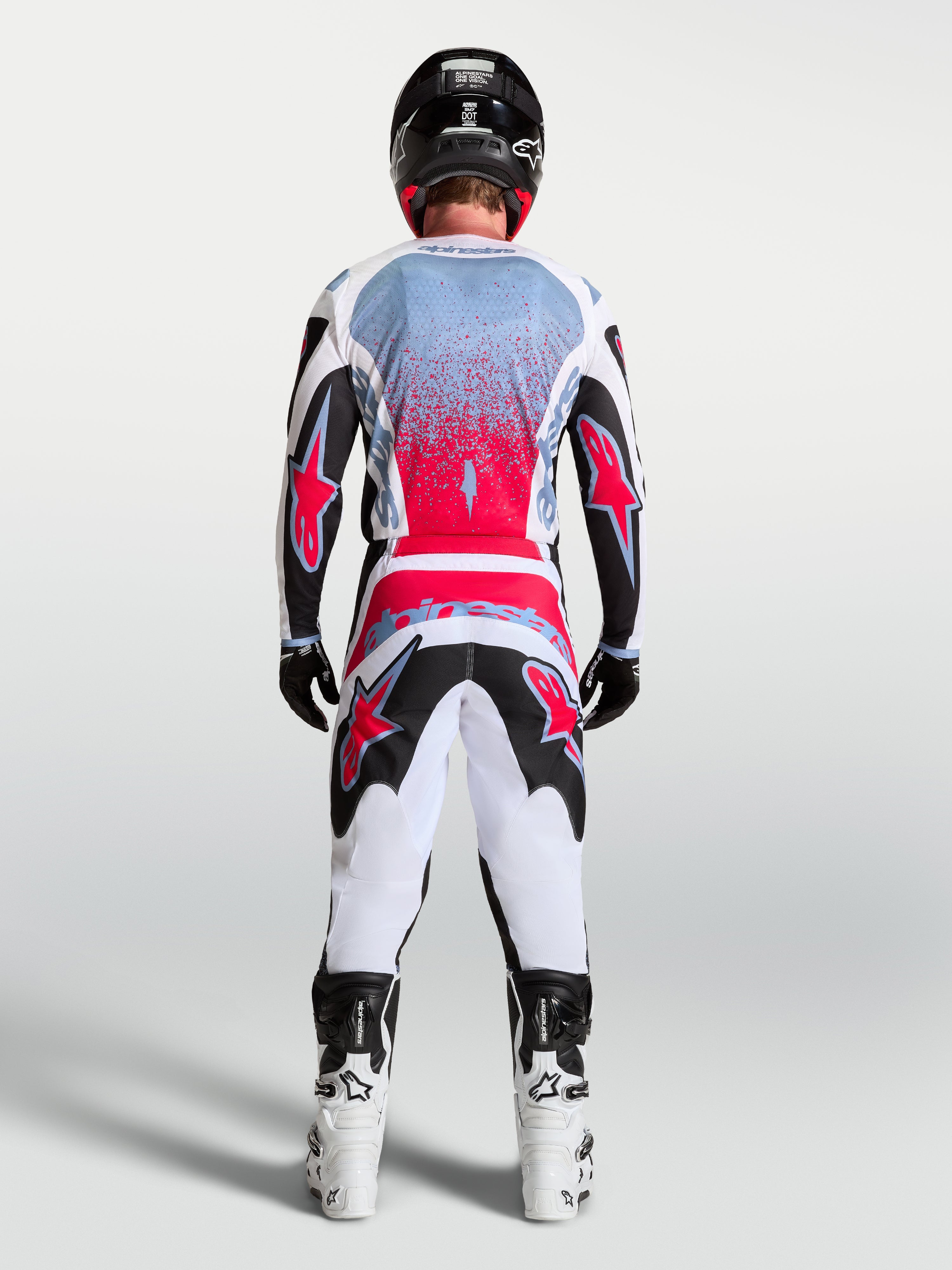 Alpinestars pantalon Fluid Drag, tenue de motocross homme, noir, blanc et rouge fluo, vue de dos, coupe ergonomique 3D.