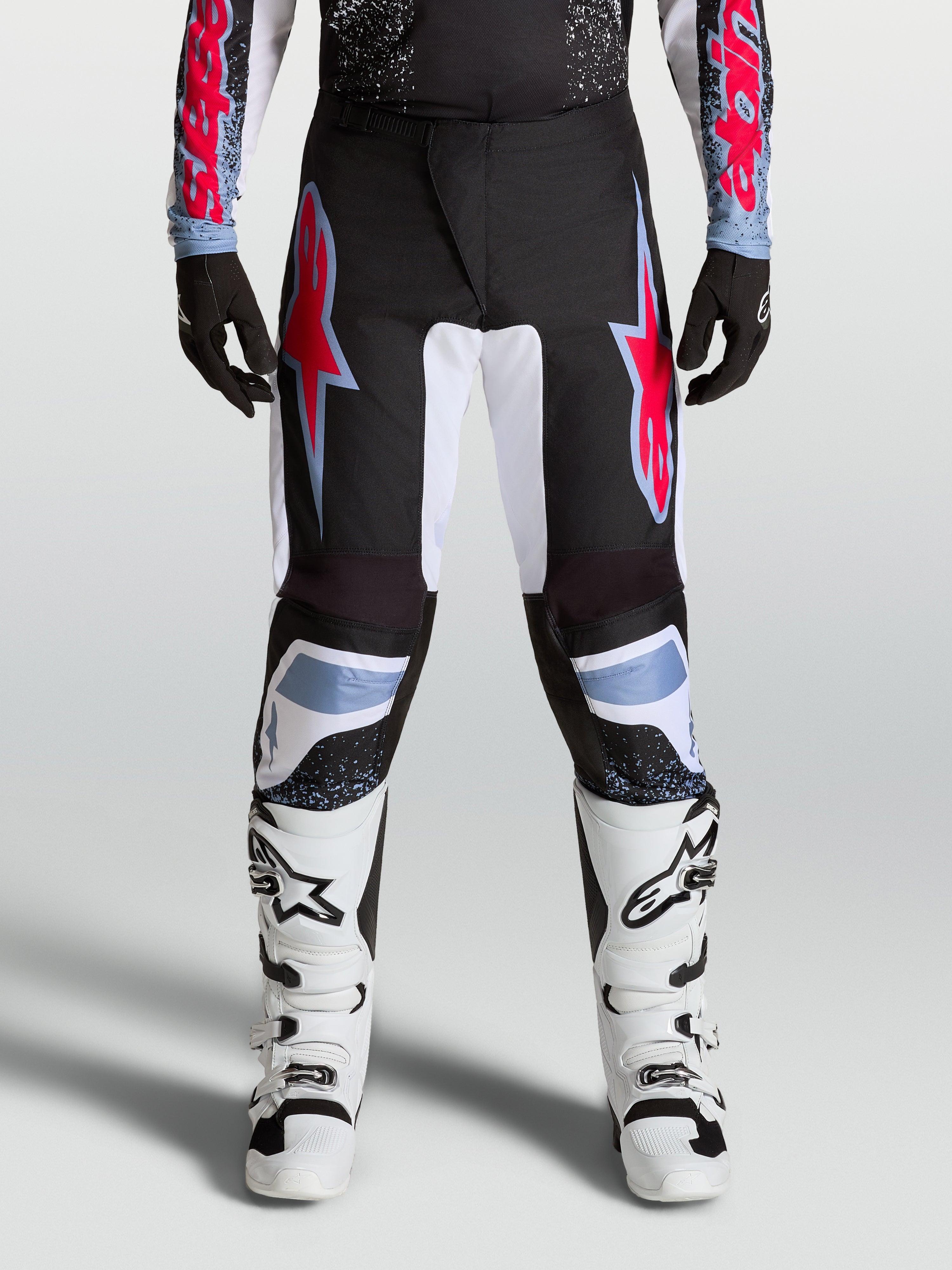 Alpinestars Fluid Drag Pants, Men's Black and Red Motocross Pants with durable 600D polyfabric and reinforced stretch panels.