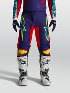 Alpinestars Pantalons Fluid Drag, équipement de motocross performance pour homme, bleu marine et rouge feu, avec une coupe sport durable.