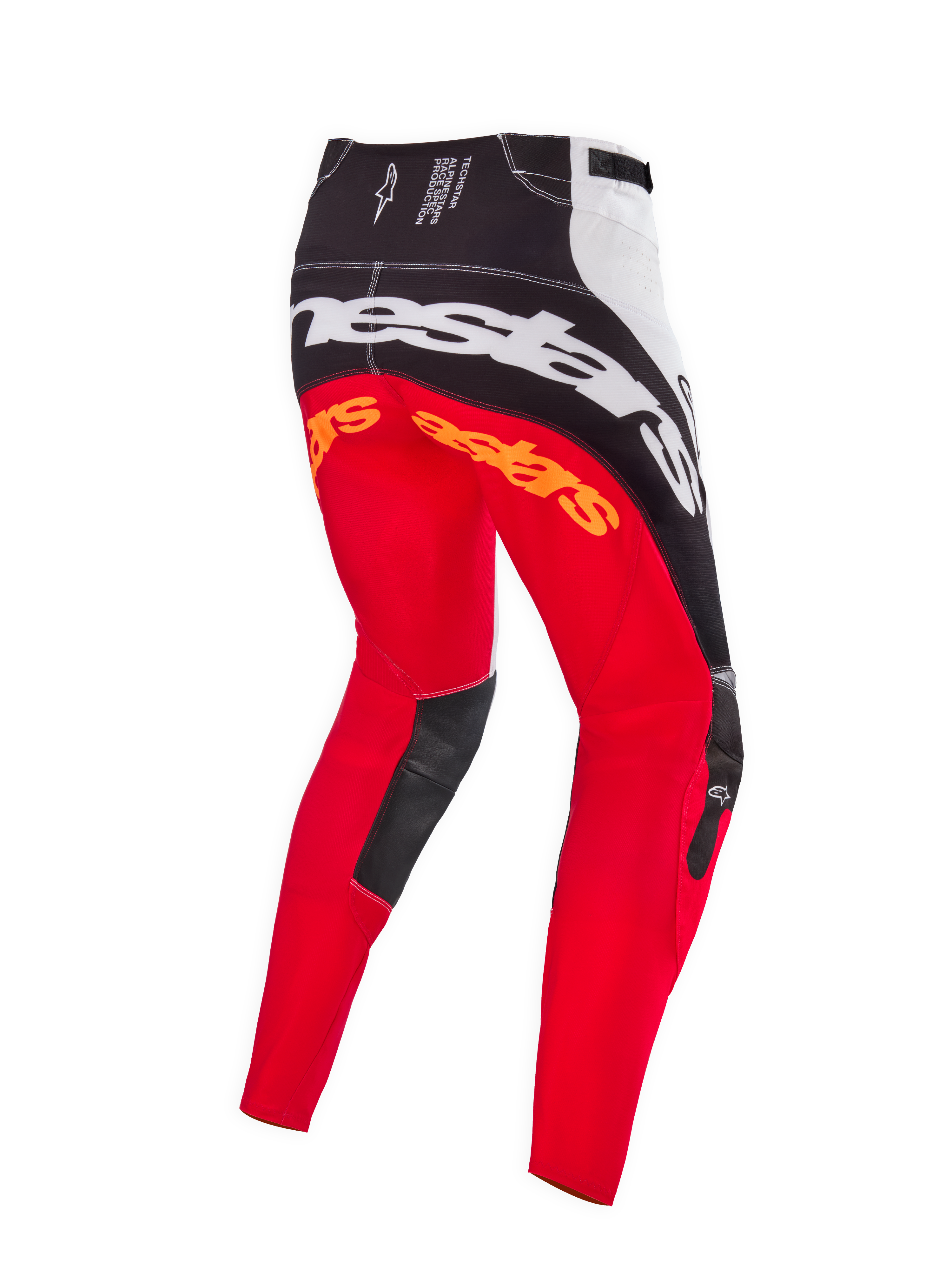 Alpinestars Techstar Deep Édition Limitée, pantalon de motocross, coloris noir, blanc et rouge fluo, vue arrière montrant le large marquage Alpinestars blanc sur l'assise, des logos orange sur le haut des jambes et des empiècements en cuir noir à l'intérieur des genoux, conçu pour la compétition tout-terrain professionnelle.