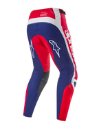 Pantalon Alpinestars Techstar Fortitude Édition Limitée, pantalon de motocross, rouge, blanc et bleu vif, vue arrière montrant l'assise et les panneaux de jambe bleus avec des accents rouges et blancs, logos étoiles blanches sur les cuisses et marquage Techstar race spec sur la ceinture