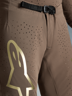 Pantalon Alpinestars Supertech Air Gold Édition Limitée, motocross, marron et doré, boucle SX1 et tissu perforé