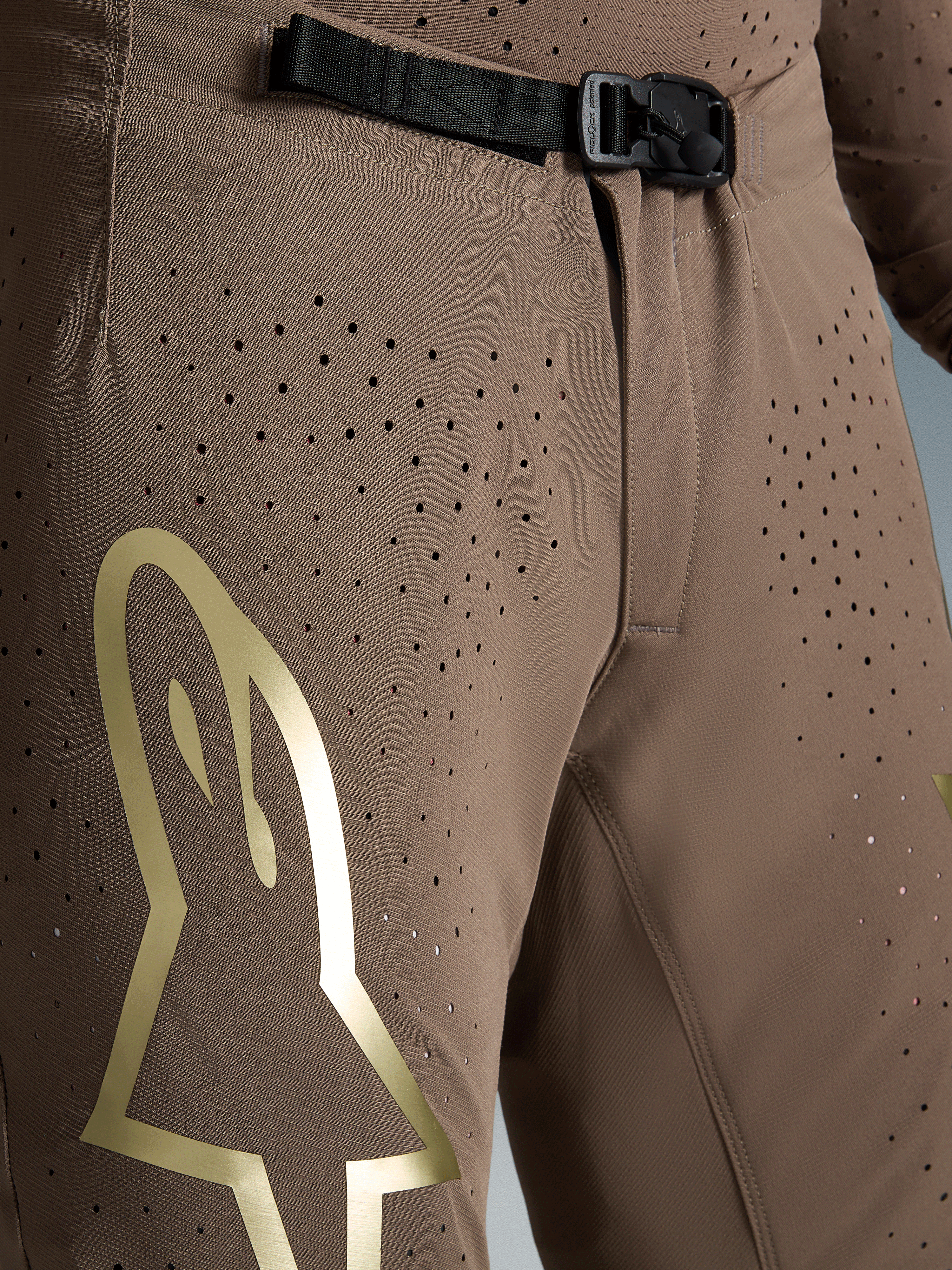 Pantalon Alpinestars Supertech Air Gold Édition Limitée, motocross, marron et doré, boucle SX1 et tissu perforé