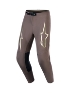 Alpinestars Pantalon Supertech Air Gold Édition Limitée, pantalon de motocross performance pour homme, marron et doré, tissu ripstop stretch ventilé avec boucle magnétique SX1 et renforts en cuir.