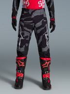 Pantalon de motocross Alpinestars Techstar Beast Coast noir et orange à motif camouflage, édition limitée.