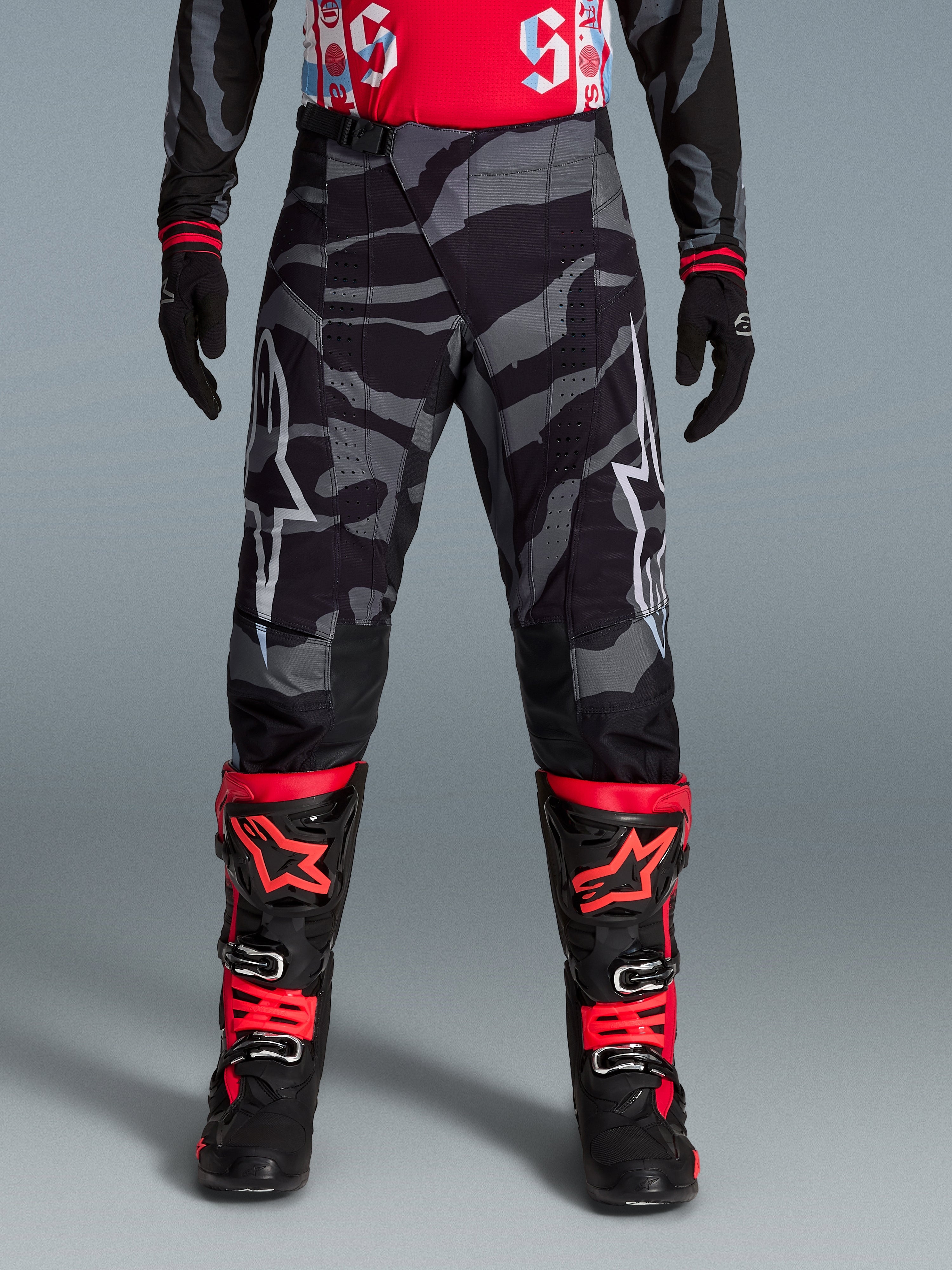 Pantalon de motocross Alpinestars Techstar Beast Coast noir et orange à motif camouflage, édition limitée.
