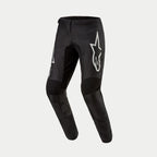 Pantalon Alpinestars Fluid Graphite 2024, pantalon de motocross, noir et argent, avec un grand logo Astar argenté sur la cuisse, panneaux de genoux renforcés noirs et design ergonomique pré-courbé pour la course tout-terrain
