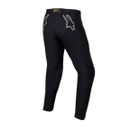 Pantalon Alpinestars Techdura, pantalon d'enduro et tout-terrain noir, vue arrière avec logos étoiles gris sur les hanches, marquage jaune sur la ceinture arrière, matériau en polyamide extensible robuste avec une conception durable pour la pratique de la moto