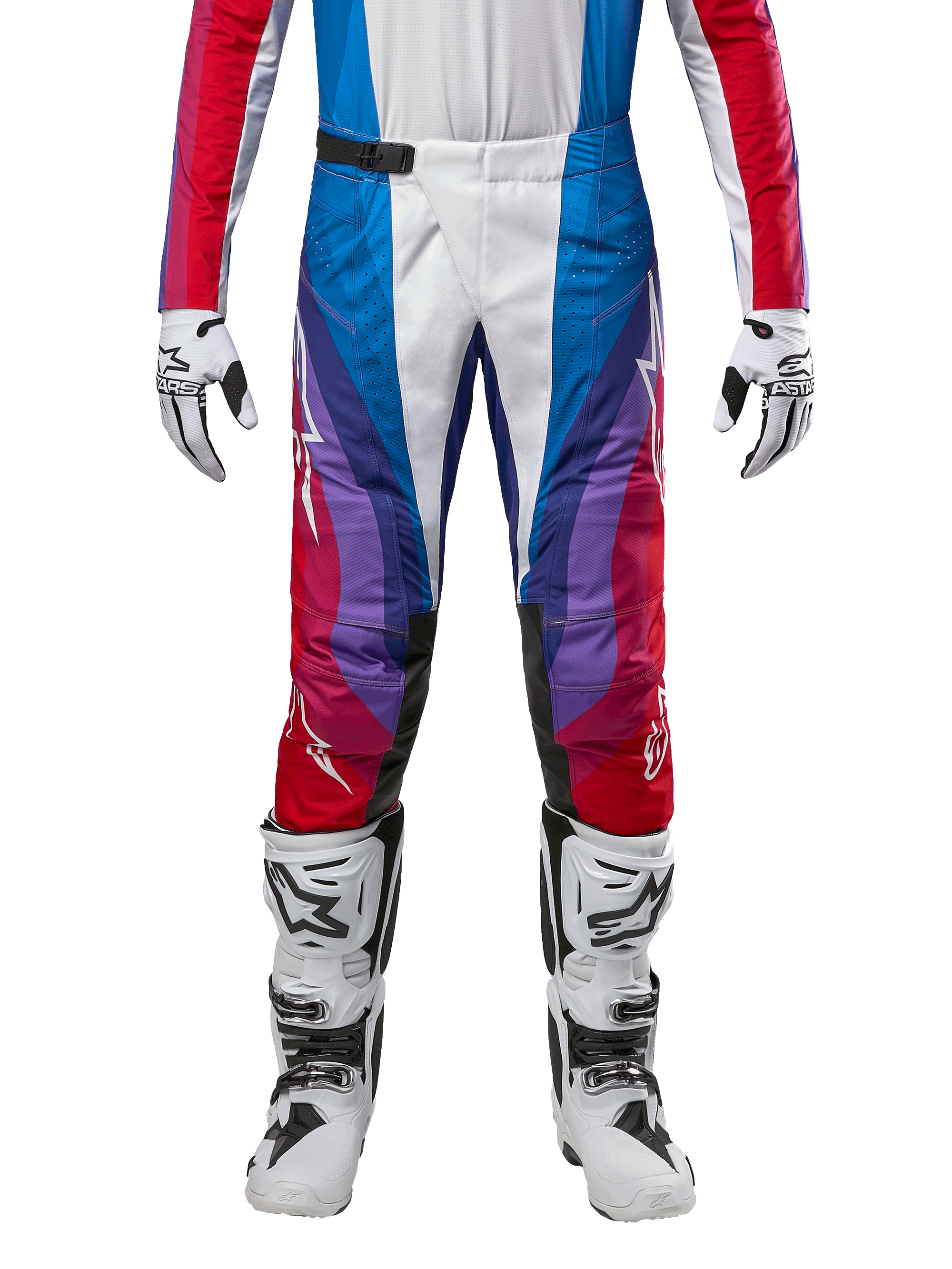 Alpinestars Techstar Pneuma Pants 2024, pantalon de motocross, bleu Mars, rouge et blanc, présentant un design angulaire multicolore avec des accents violets, associé à des bottes de motocross blanches et noires et des gants assortis, coupe de course athlétique pour la performance tout-terrain