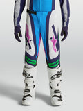 Pantalon Alpinestars Supertech Maven Junior, pantalon de motocross blanc et bleu, détails vert fluo, coupe performance.