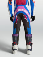 Pantalon Alpinestars Supertech Maven Junior, motocross, bleu et corail, vue de dos avec assise renforcée et coupe athlétique.