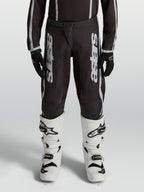 Pantalon Alpinestars Fluid Apex V2 Junior, pantalon de motocross noir et argenté, jambes préformées ergonomiques pour enfant