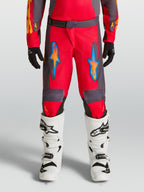 Alpinestars Fluid Hunt Junior, pantalons de motocross rouges et gris pour enfant, design ergonomique en polyfibre.