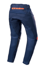 Alpinestars Youth 2023 Racer Narin Pants, pantalon de motocross, bleu marine et orange, vue arrière montrant le logo Alpinestars orange à la taille et les renforts intérieurs des jambes en cuir noir, conception en textile durable pour le tout-terrain
