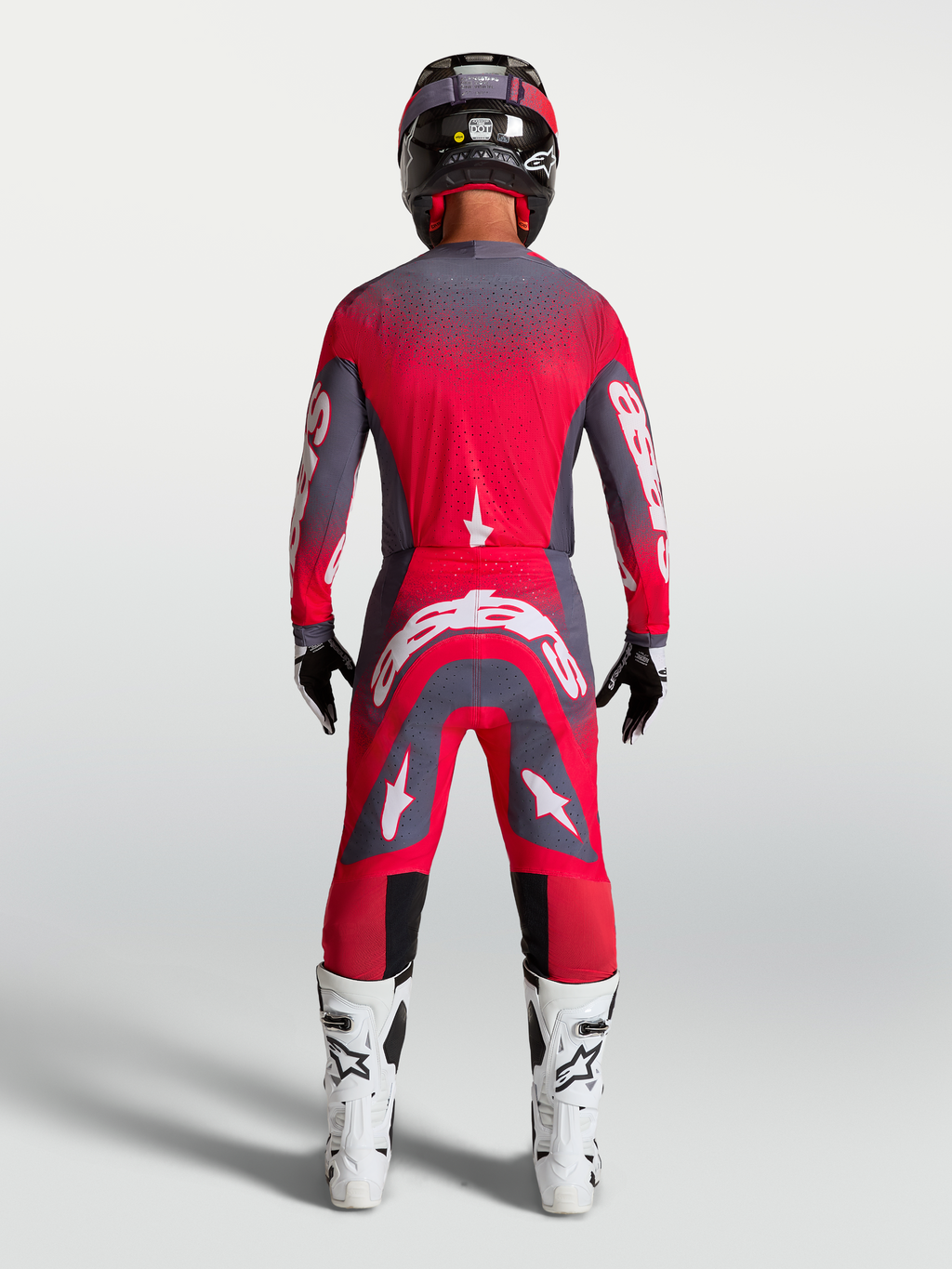 Maillot Alpinestars Supertech Hiten AFD, rouge fluo et gris, équipement de motocross professionnel, vue de dos sur mannequin