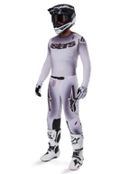 Motocross rider wearing complete racing gear, grey and white gradient jersey with black 'astars' branding, matching pants with red accents and star logos, black and white helmet with dark goggles, white Alpinestars Tech 10 Boots, professional off-road racing outfit