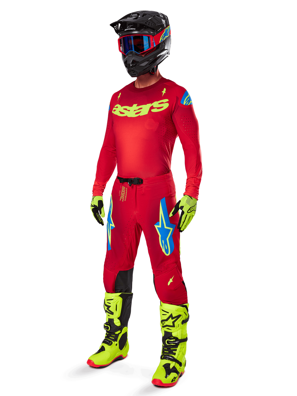 Alpinestars Supertech Maker Gear Set 2025, tenue de motocross complète, maillot et pantalon rouges avec accents jaunes et bleus, bottes et gants jaune fluo, casque noir avec lunettes bleues, équipement professionnel haute performance pour la course tout-terrain