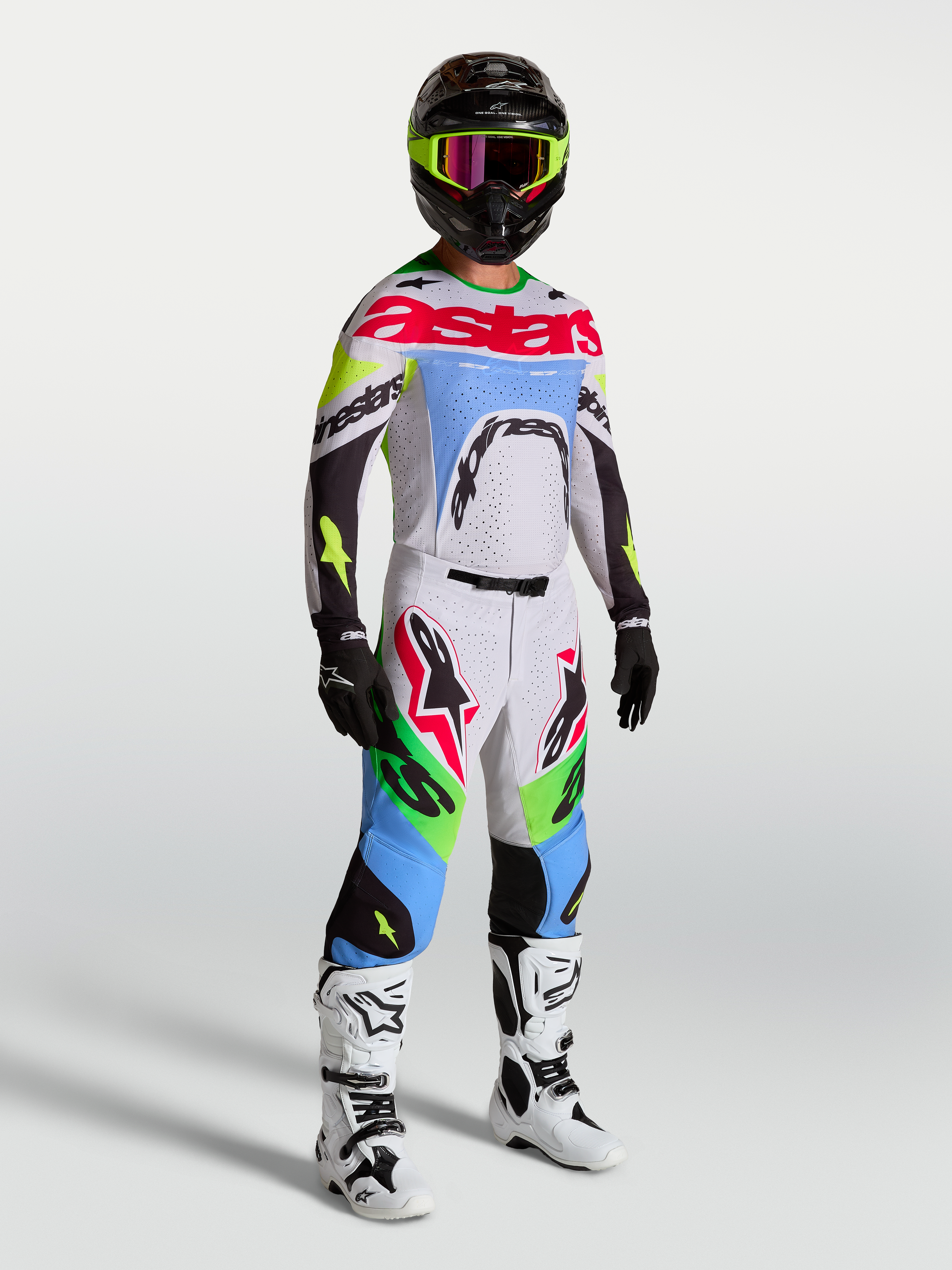 Alpinestars Supertech Dyna 2027, ensemble maillot et pantalon de motocross, lilas clair et vert fluo, coupe athlétique.