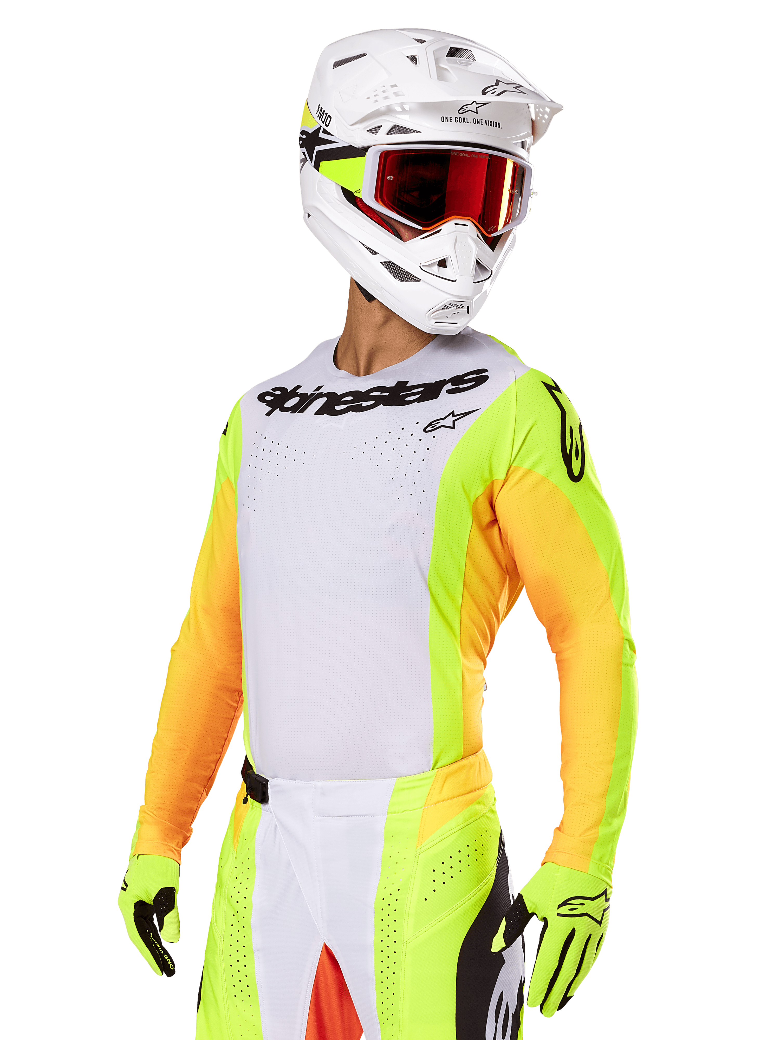Motocross rider wearing Alpinestars 2025 Techstar Melt Gear Set, white jersey with vibrant yellow and orange sleeves, black 'Alpinestars' chest branding, matching neon yellow gloves, white helmet with red-tinted goggles, professional off-road racing kit