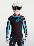 Maillot Alpinestars Supertech Vesta noir et turquoise, haut de motocross pour homme avec perforations laser respirantes.