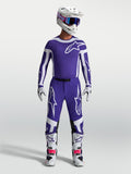 Alpinestars maillot Supertech Vesta et ensemble de motocross, bleu foncé et blanc, avec casque et bottes, homme.