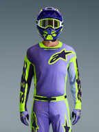 Alpinestars 2026 Racer Portl Gear Set, full motocross racing gear in purple and lime green, featuring a purple jersey with neon yellow sleeves and dark purple Astar logo, matching purple and green helmet with white goggles, and coordinated pants and gloves for off-road riding.