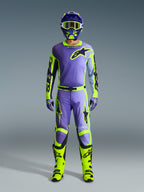 Alpinestars 2026 Racer Portl Jersey, Purple and Yellow Fluo, worn as part of a complete motocross gear set with matching pants, helmet, and bright neon yellow boots, professional off-road racing outfit.