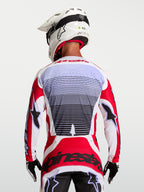 Alpinestars Techstar Maven Jersey, Motocross Racing Jersey, Fire Red and White, breathable textile, back view on rider.