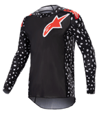 Alpinestars 2023 Supertech North Jersey, maillot de motocross, noir et rouge néon, manches longues avec motif moucheté blanc, logos étoiles rouges et blancs sur la poitrine et les épaules, maille performance légère avec coupe athlétique