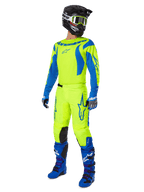 Alpinestars 2025 Fluid Haul Gear Set, full motocross racing gear with Yellow Fluo and Blue jersey and pants, black helmet, blue gloves, and blue off-road boots, high-visibility coordinated outfit for motocross and enduro.