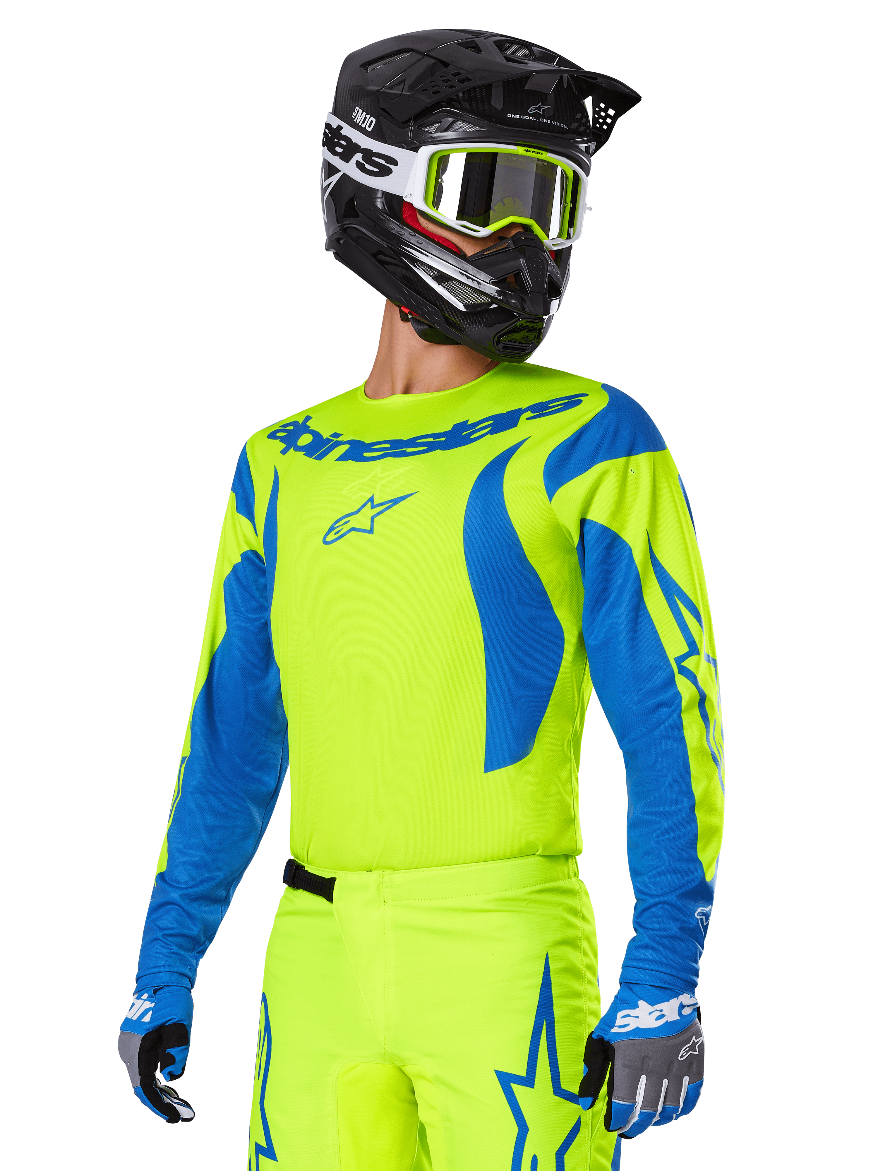 Ensemble d'équipement Alpinestars Fluid Haul 2025, maillot et pantalon de motocross, jaune vif et bleu, porté avec un casque noir et des lunettes à monture jaune, présente des motifs bleus ondulés sur les manches et des logos d'étoiles bleues sur le pantalon, tenue de course tout-terrain coordonnée