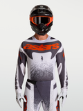 Maillot Alpinestars Techstar Swan pour homme, maillot de motocross blanc et gris avec accents rouge fluo, coupe athlétique.