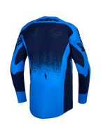 Alpinestars maillot Techstar Swan, maillot de motocross bleu clair et bleu foncé, perforations laser et pan arrière allongé.