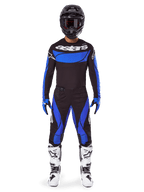 Tenue complète Alpinestars Techstar Dreem 2025, équipement de motocross pour homme en textile noir et bleu avec bottes blanches.