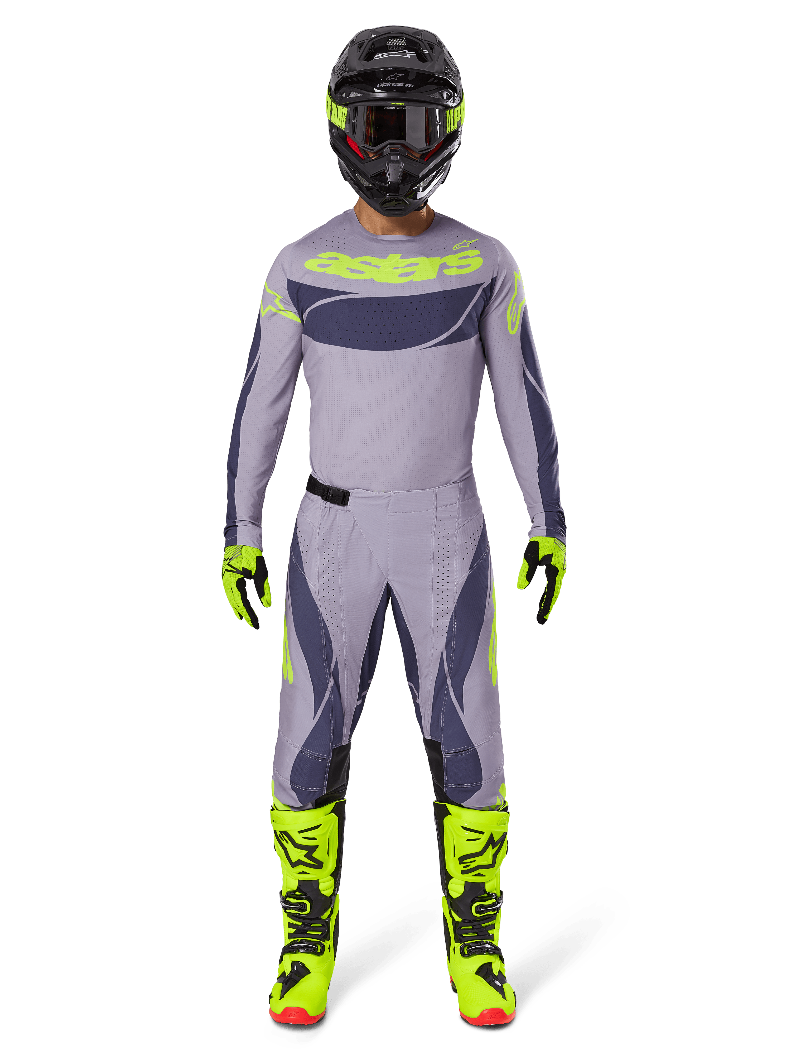 Pilote de motocross portant l'ensemble d'équipement Alpinestars 2025 Techstar Dreem en gris et gris foncé avec des accents jaune néon vifs, comprenant le maillot et le pantalon assortis, des bottes jaune néon et un casque noir, conçu pour la course tout-terrain professionnelle.