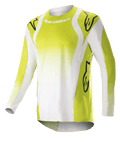 Maillot Alpinestars Techstar Push 2023, maillot de motocross à manches longues, jaune fluo et blanc, avec de grands logos Astars noirs sur les épaules et les manches, tissu technique perforé, col rond et pan arrière rallongé pour la course tout-terrain