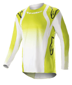 Maillot Alpinestars Techstar Push 2023, maillot de motocross à manches longues, jaune fluo et blanc, avec de grands logos Astars noirs sur les épaules et les manches, tissu technique perforé, col rond et pan arrière rallongé pour la course tout-terrain